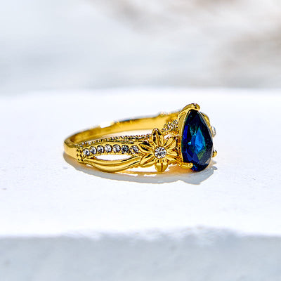 Olivenorma Blue Topaz with Floral Zircon Accents Ring