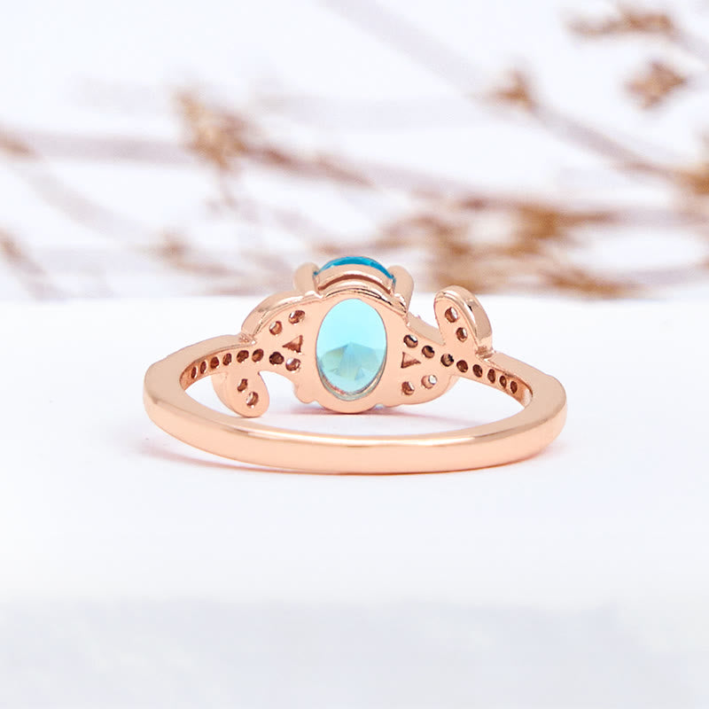 Olivenorma Oval Cut Blue Topaz Wrapped Leaf Ring